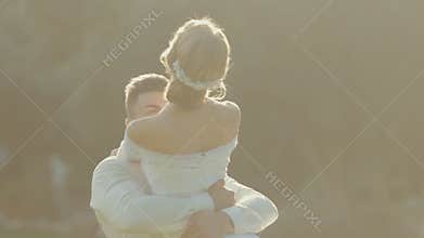 The groom comes to his beautiful bride and