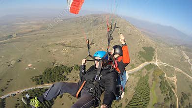 Men being afraid while paragliding