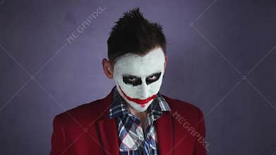 Creepy joker laughing