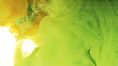 Color ink drop in water. green, orange, yellow