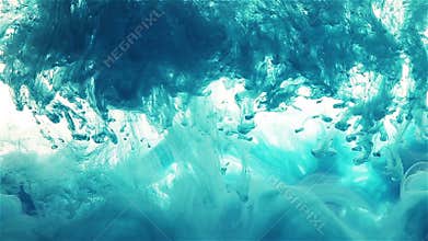 Color ink drop in water. blue, cyan color spread