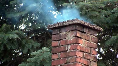 Brick Chimney Puffing Out Smoke