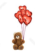 Teddy bear with red heart shaped balloons.
