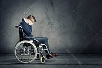 Sad man in wheelchair