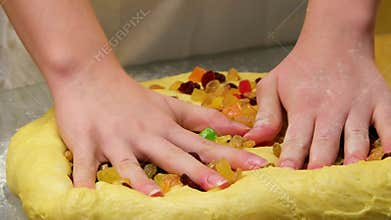 Step by step kneading sweet dough with raisins and dried fruits for festive homemade bread