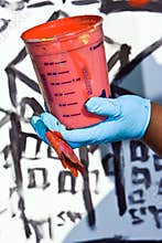 Bucket with red paint