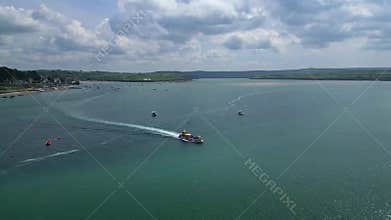 River Camel, North Cornwall, England: DRONE VIEWS: A passenger ferry crosses the river on route from Rock to Padstow
