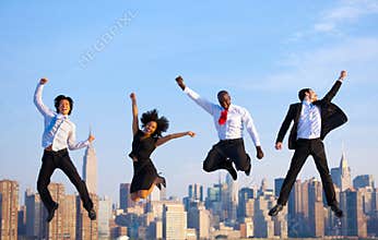 Happy Successful Business People Celebrating by Jumping in New Y