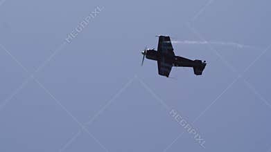 4K Slomo Unlimited Aerobatics Plane Tumbling With Curved Smoke