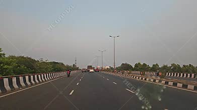 Driving on Modern Highway Bridge in India, Smooth Road Travel POV with Urban Infrastructure Scene, India