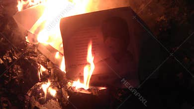 An empty box of anti-viral Respirator masks burns.
