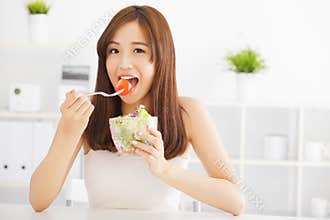 Asian young woman eating healthy food