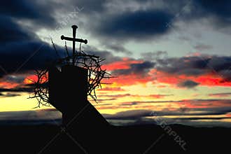 Cross od Nails and Crown of Thorns on Fence Post Silhouette