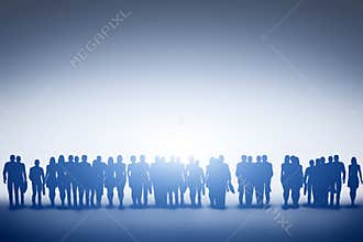 Group of various people looking towards light, future.