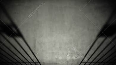 Prison cell door closing shadow on dark concrete jail floor.