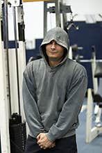 Man with hoodie in gym