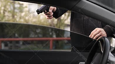 The criminal committed an armed robbery of the driver of the car.