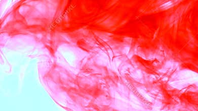 Red ink in water. Abstract