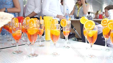 Cocktails with lemon and orange in glasses. Cocktail party at a