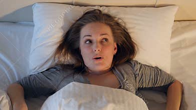 Young woman suffering from the nightmare. Close-up. 4K.