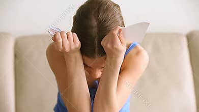 Upset desperate woman crying, teenage girl tearing photo, breakup concept