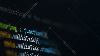 Software code scrolling at computer screen.