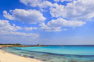 Summer seascape,Apulia coast: Marina di Lizzano beach Taranto, Torretta bay. In the background the Torretta watchtower.
