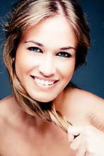 Woman with strong blond hair and beautiful smile