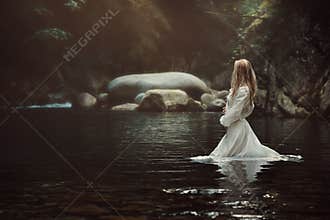 Beautiful woman in mystical stream