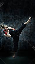 Kick boxer woman wearing boxing gloves