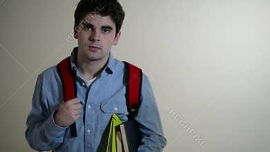 Male College Student Walks Towards Camera And Smiles