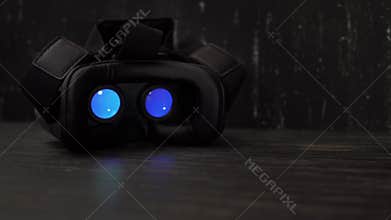 Playing movie inside virtual reality device at night with copy space. 4k UHD
