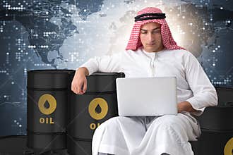 The arab businessman trading crude oil on laptop