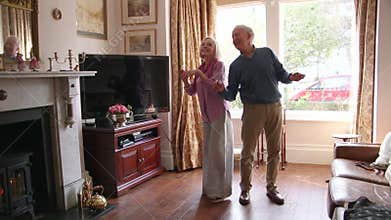 Senior Couple Dancing At Home
