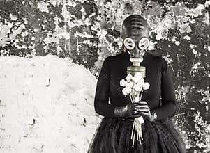 The girl in a gas mask. The threat of ecology.