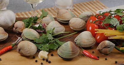 Dolly panning view of ingredients for spaghetti alle vongole clams