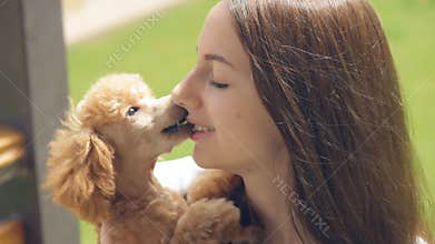 Young girl with her dog in the outdoor