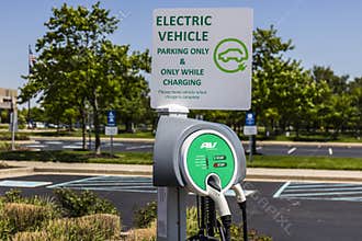 Fishers - Circa May 2017: Electric Vehicle Charging area. Electric vehicles and charging stations are becoming popular I