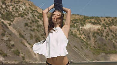 Beautiful young brunette girl at luxury yacht