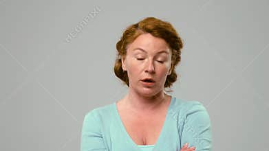 Actress in studio talking with irritation and anger.