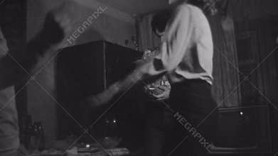 Old vintage black and white film friends have party dancing in living room