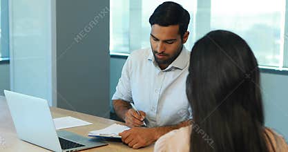Recruiter taking interview of female candidate