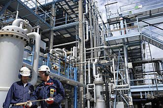 Oil and fuel with workers