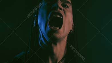 Horror scene with suffering demon man have many terrible faces