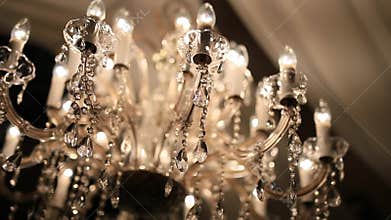 Chandelier in the apartment. A beautiful chandelier on the ceili