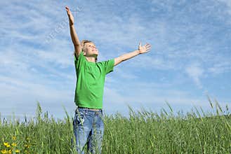 Happy child arms raised in prayer