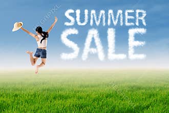 Woman jumps with summer sale cloud