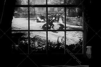 View of street fight through window