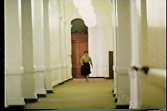 Long shot woman in a hurry walking down long hallway