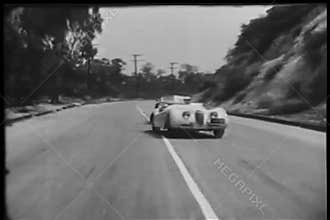 Two sports cars trying to overtake each other during race